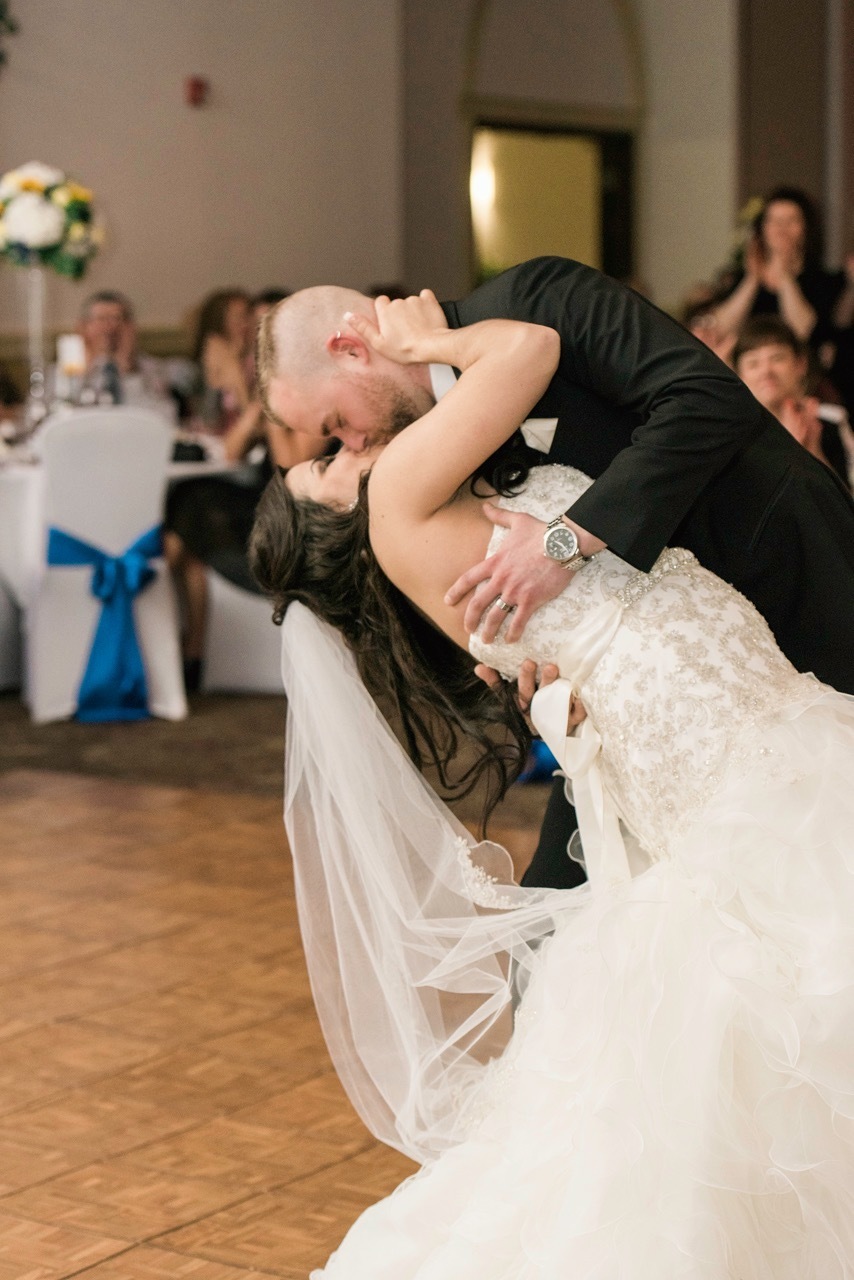 a bride and groom share their first dance